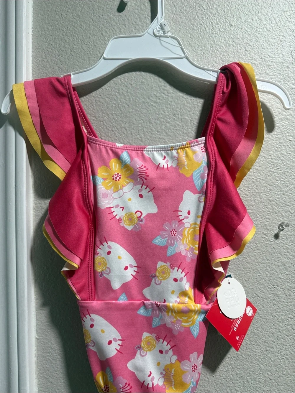 Hello Kitty Pink Floral Ruffle One-Piece Swimsuit with Yellow Trim.  New size 6